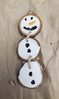 Painted snowman with three wood slices