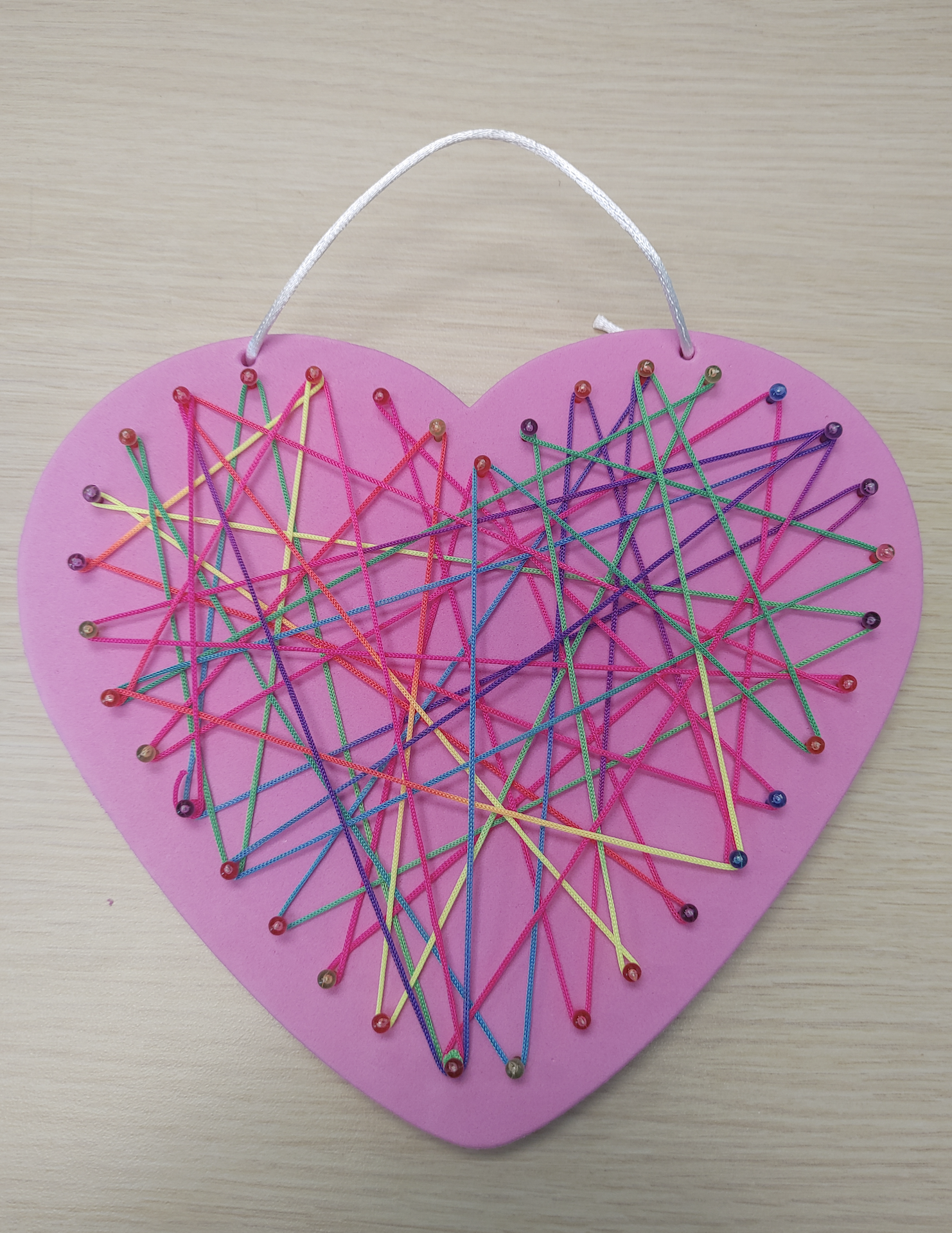 Pink heart with string