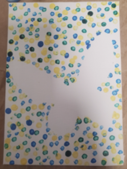 Canvas with paint dots and butterfly silhouette