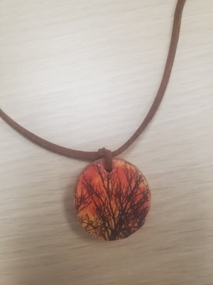 Harvest moon pendant on leather necklace