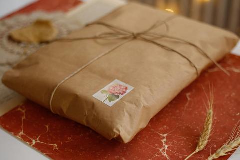 Book wrapped in brown packaging