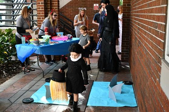 Kids in costume trick or treat at City Hall