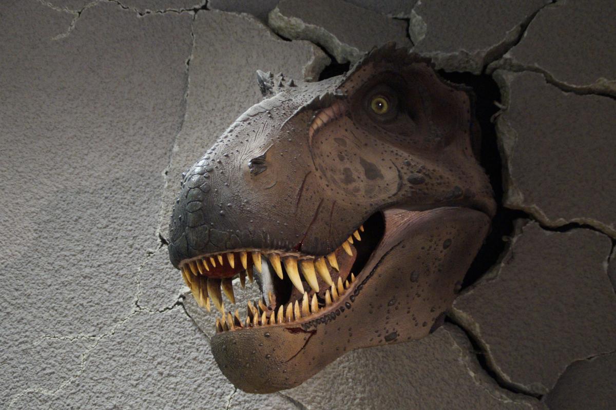 Tyrannosaurus Rex bursts through the wall